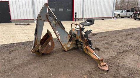 gehl skid steer backhoe attachment|old style gehl attachments.